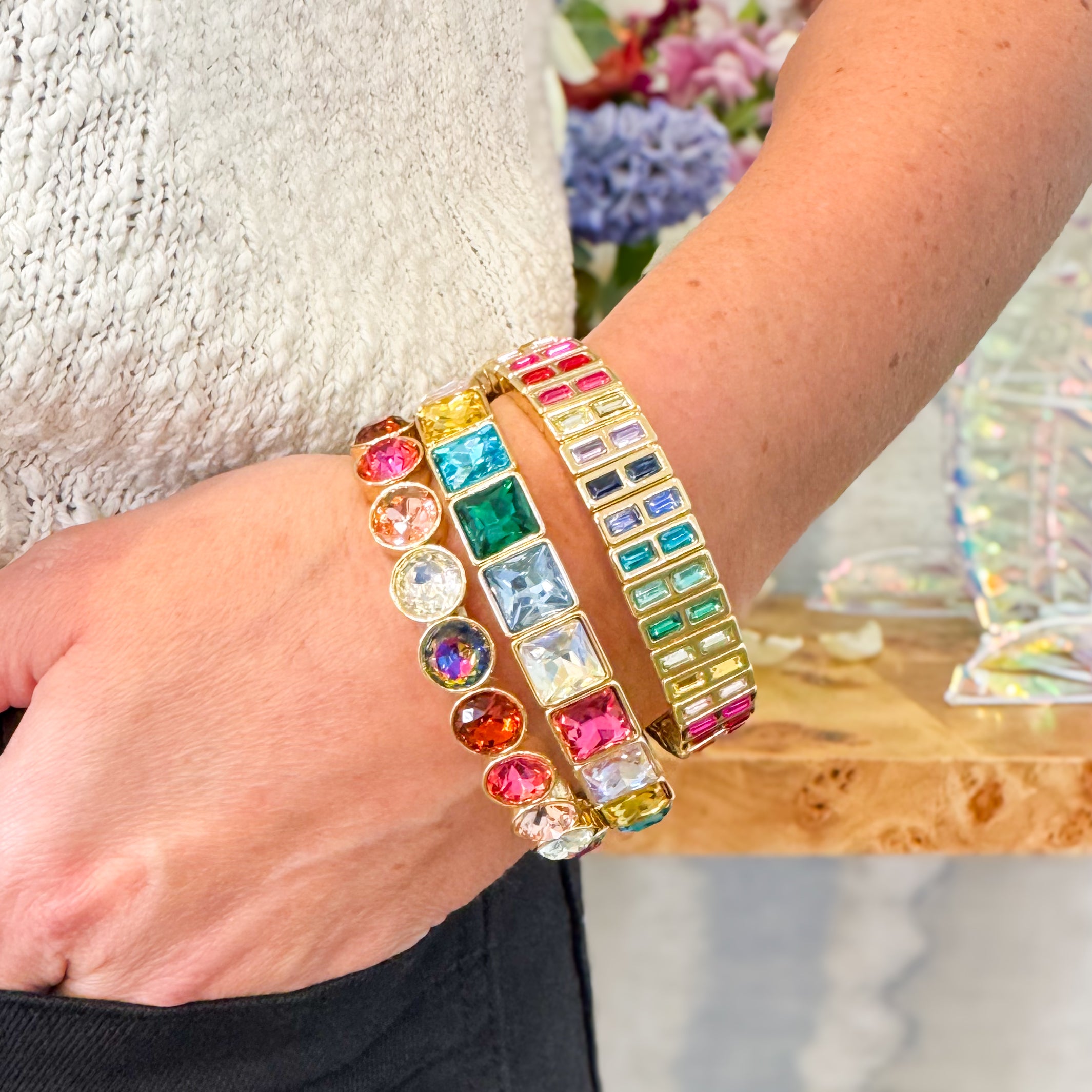 Colorful beaded bracelet on a wrist with a blurred background