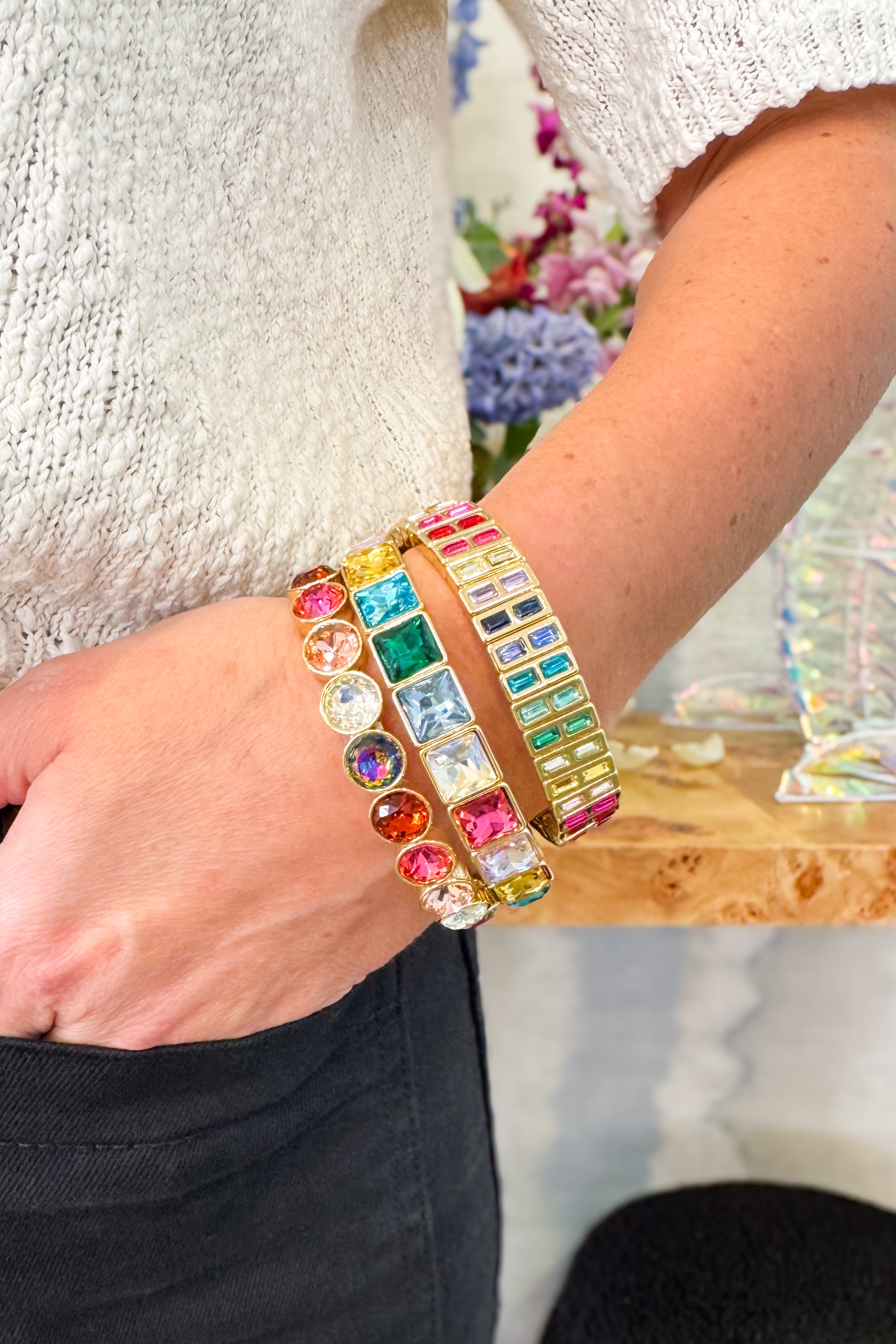 Colorful beaded bracelet on a wrist with a blurred background